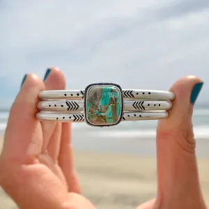 Hand-stamped turquoise cuff set in silver