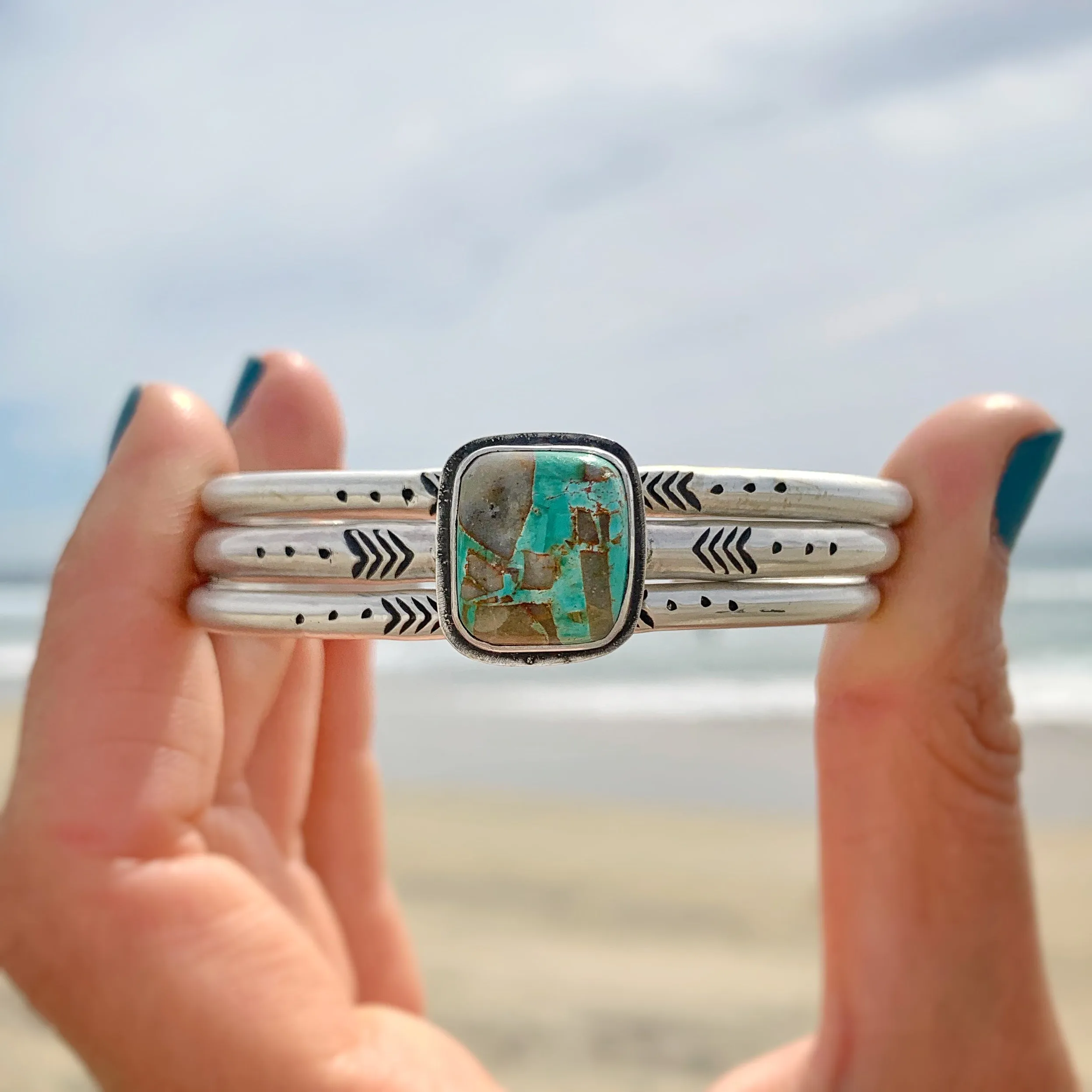 Hand-stamped turquoise cuff set in silver