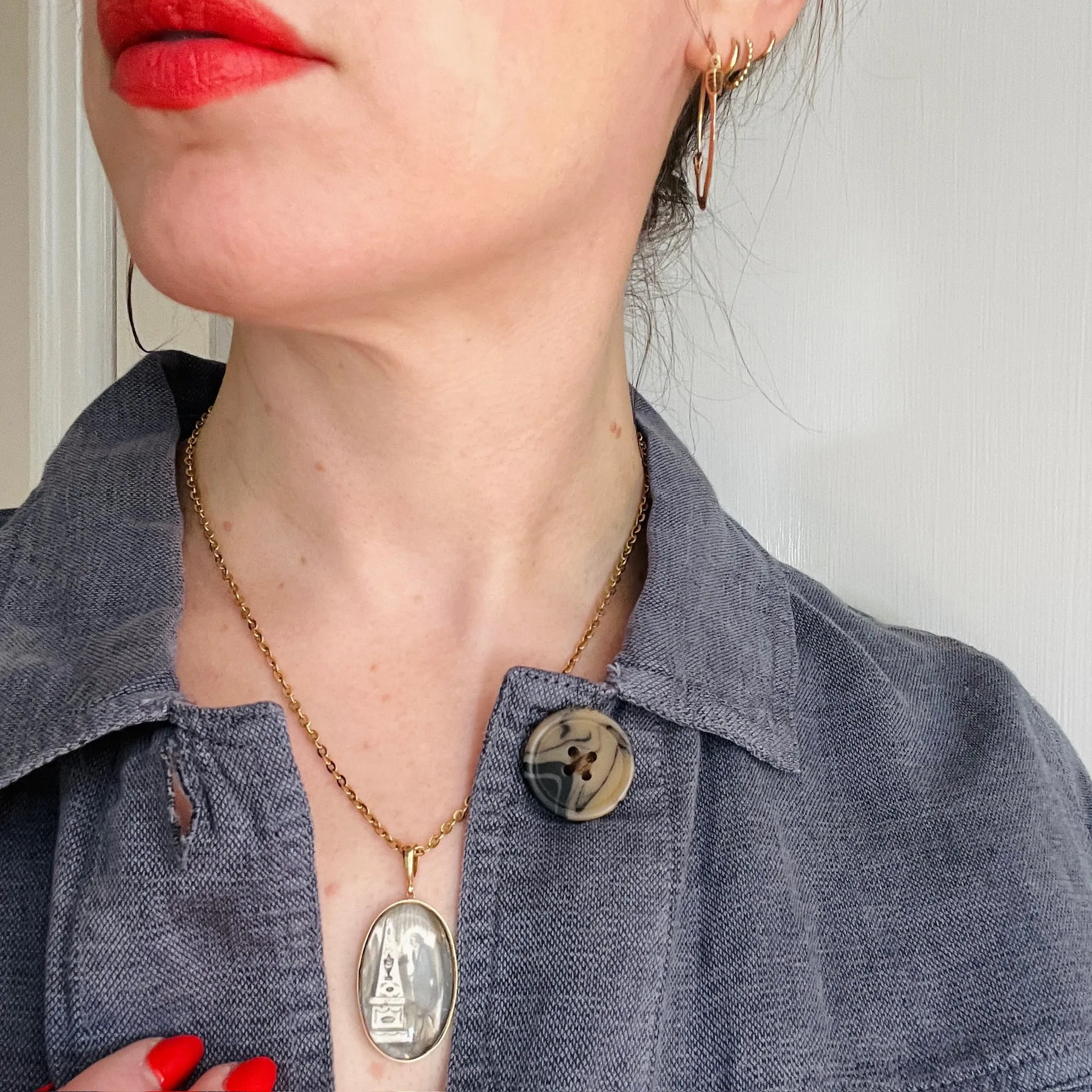 Somber Miniature Painting in Gold Pendant