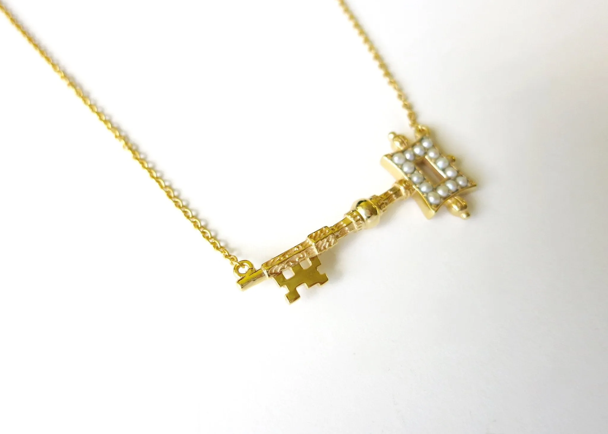 Stunning, soulful, pearl encrusted, gold-plated key pendant necklace
