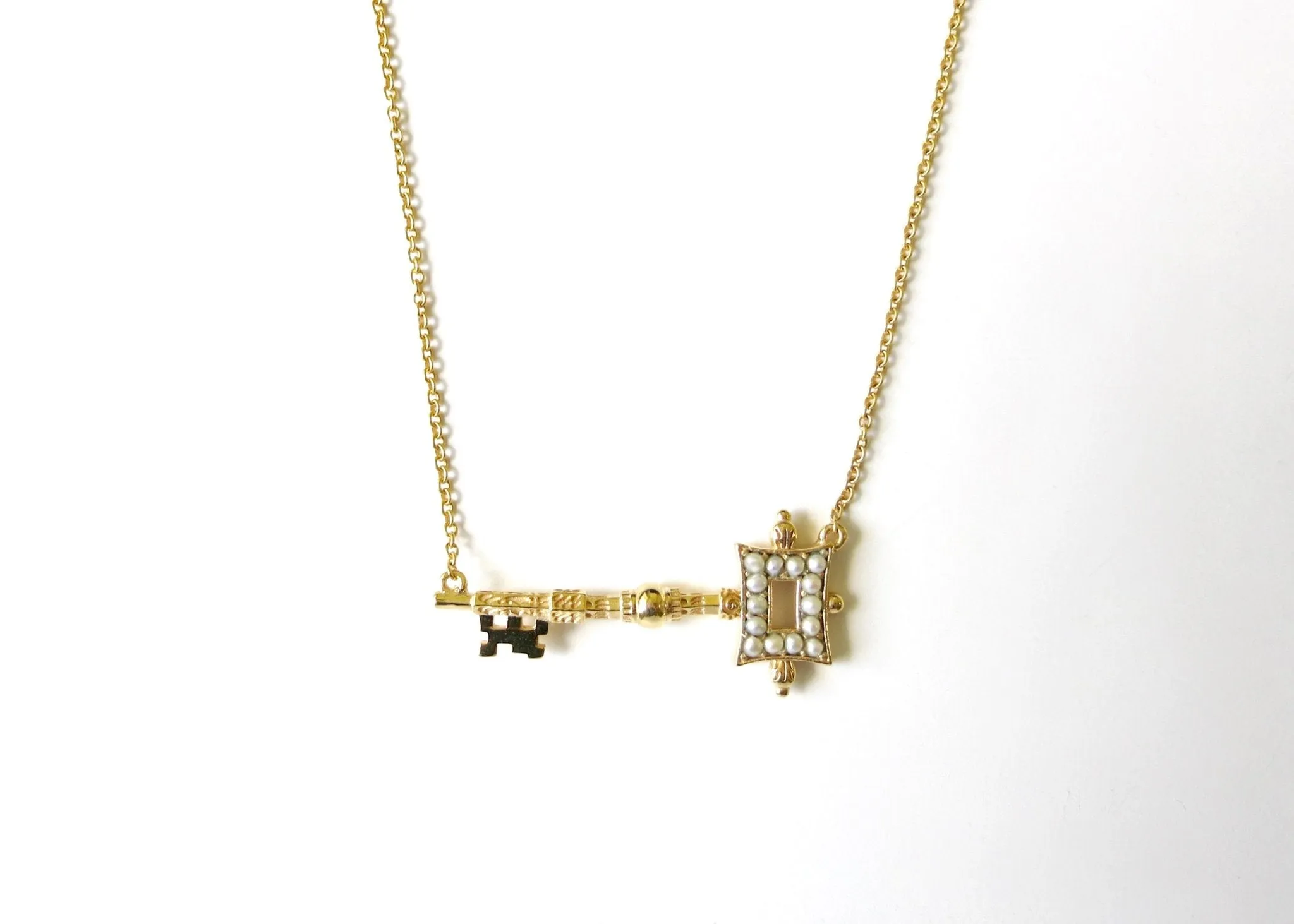 Stunning, soulful, pearl encrusted, gold-plated key pendant necklace