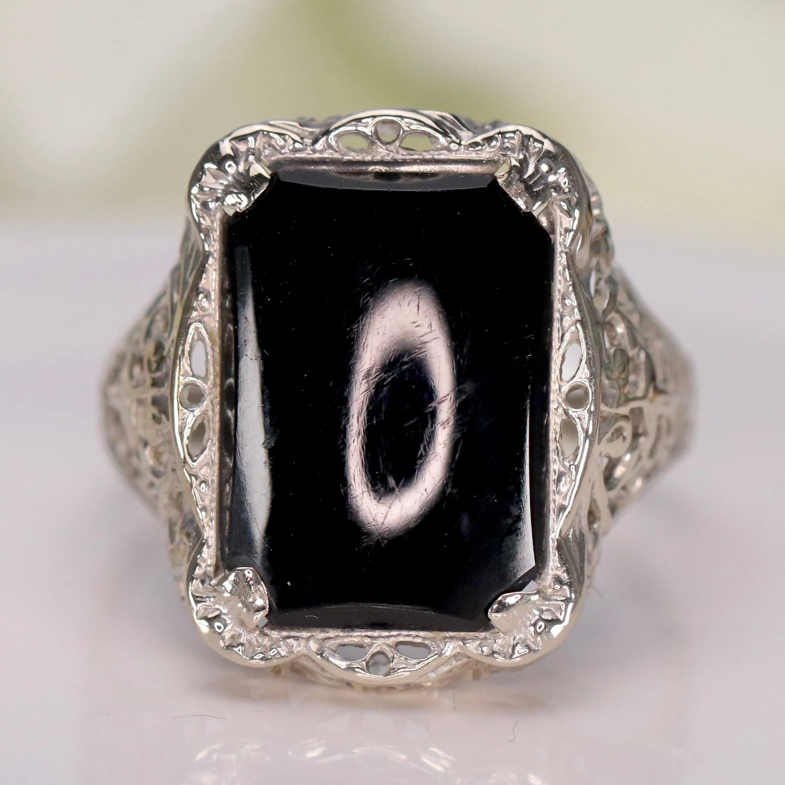 Vintage onyx filigree ring in white gold